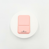 Small portable foldable mirror, lightweight, durable, and ideal for travel, touch-ups, and on-the-go beauty routines. Available in pink and cream color.